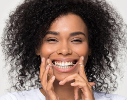 Lady showing her teeth after teeth whitening treatment 